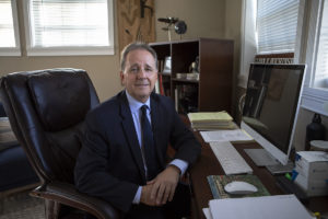 Glenn Wichinsky sitting behind his office desk - Glenn is a Gaming and Business Law attorney based in Boca Raton, Florida. As a licensed attorney in the states of Florida and Nevada